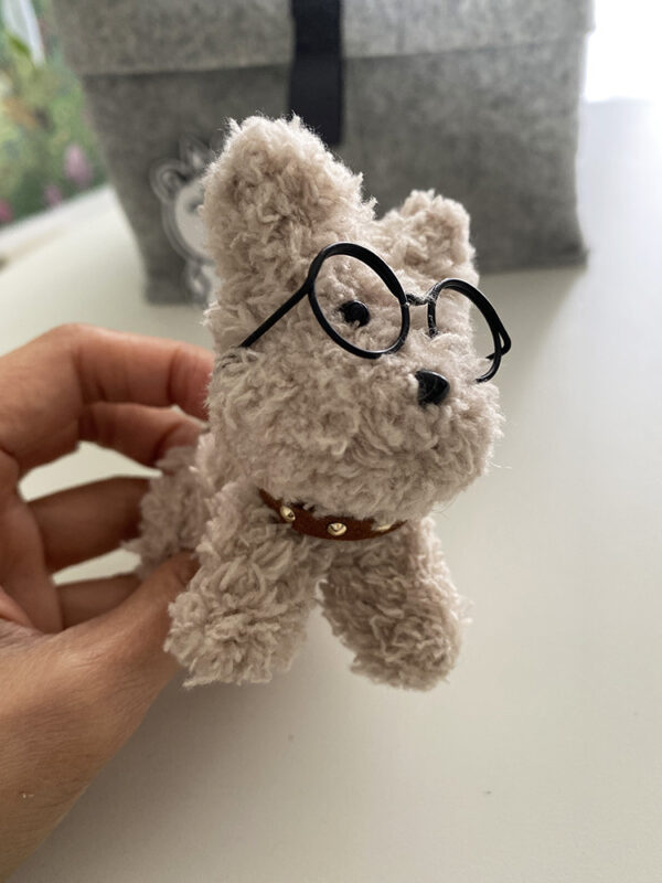 Little puppy with glasses